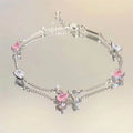 Pulsera Flor de Cerezo Rosa con Cristales – Diseño Luna y Moño Ajustable.
